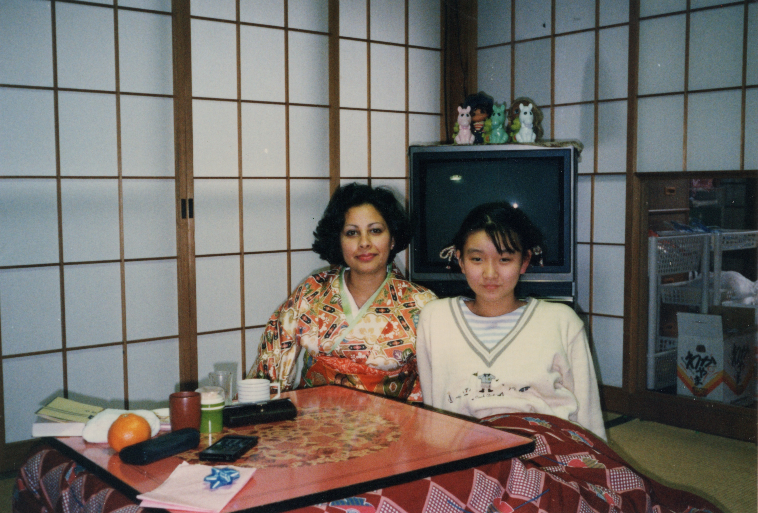 Ghada seated at a table in a Japanese room